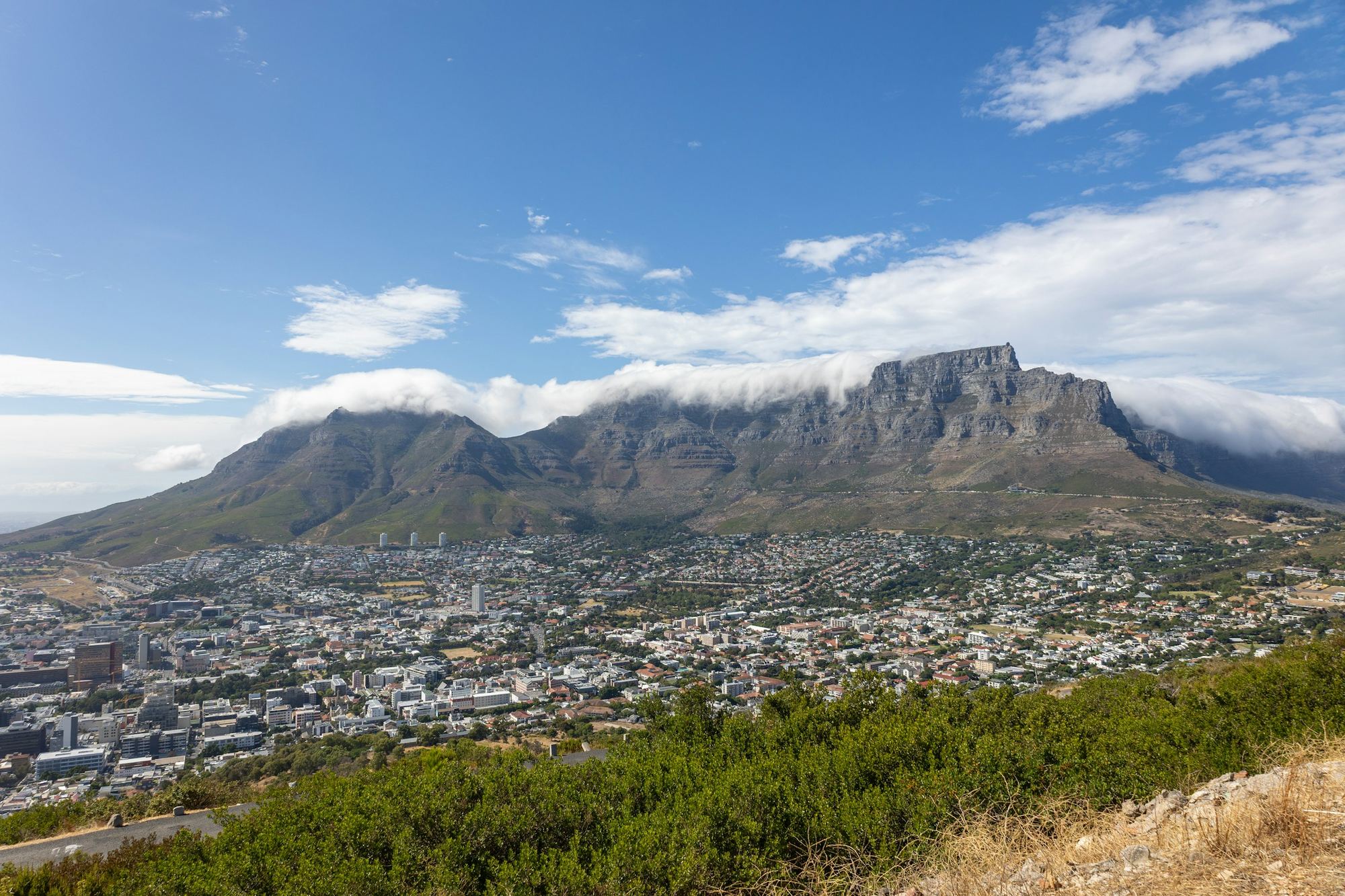Table Mountain rising above Cape Town under a cloudy sky